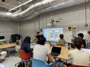 The Design Subteam's Student Lead presenting to students