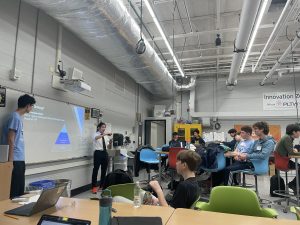 The Strategy and Scouting Subteam's Student Lead presenting to students
